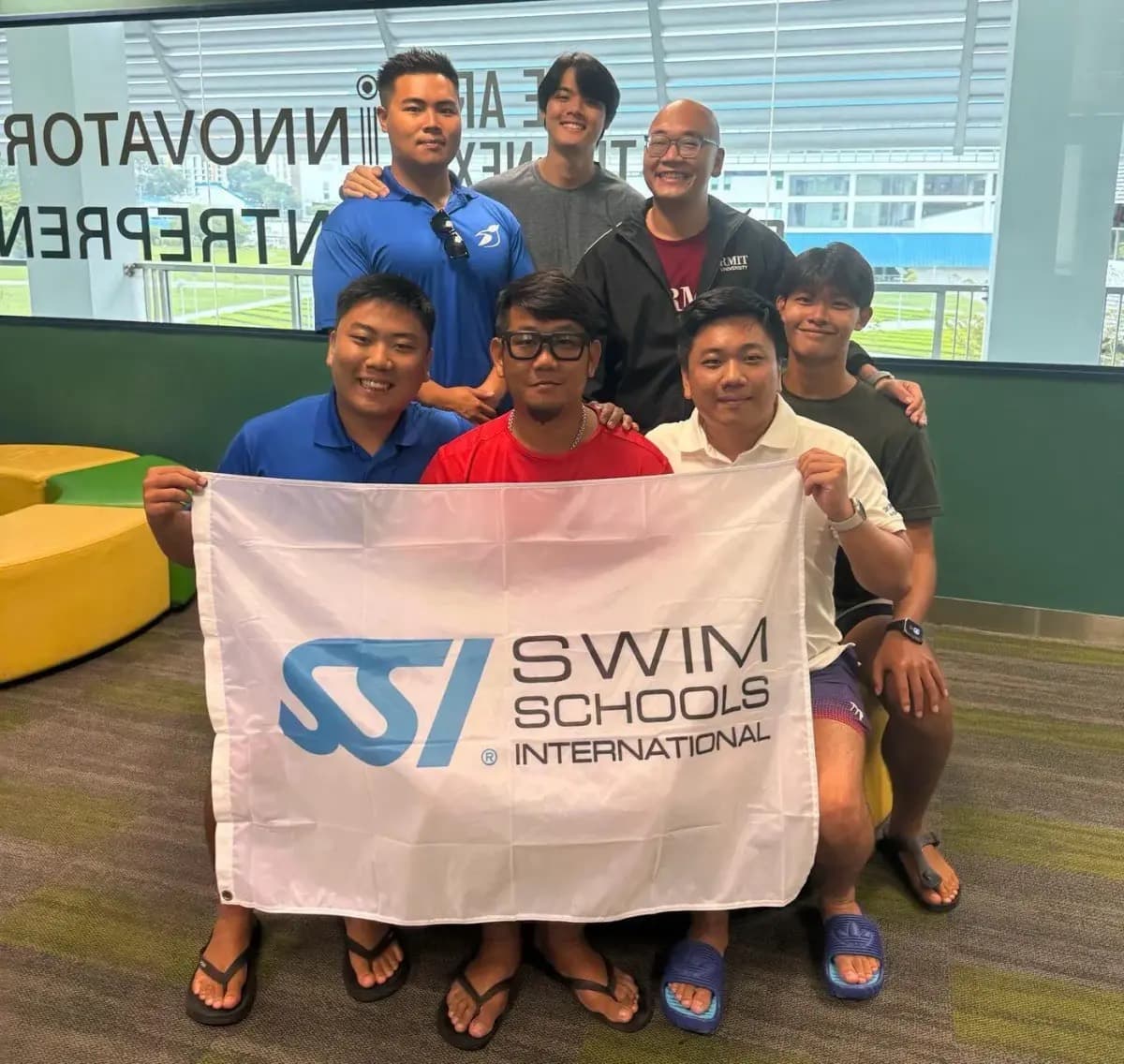 Penguin Academy swim teachers completing professional development together in Singapore